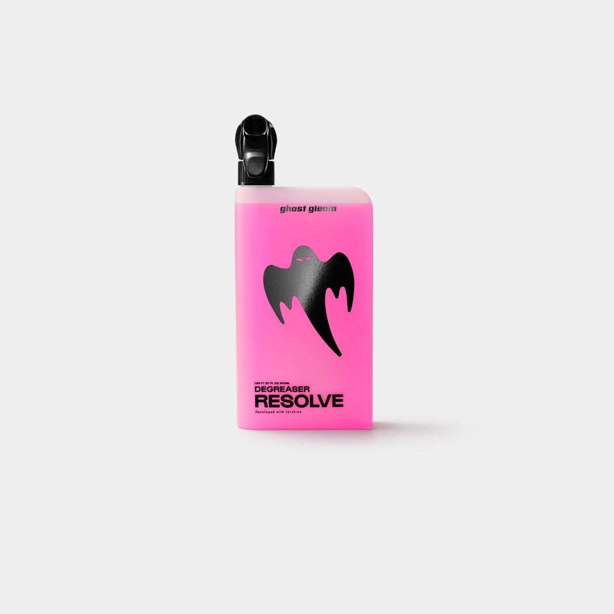 Translucent spray bottle with pink degreaser inside, with a black nozzle and the black ghost logo on the front. Against a white background