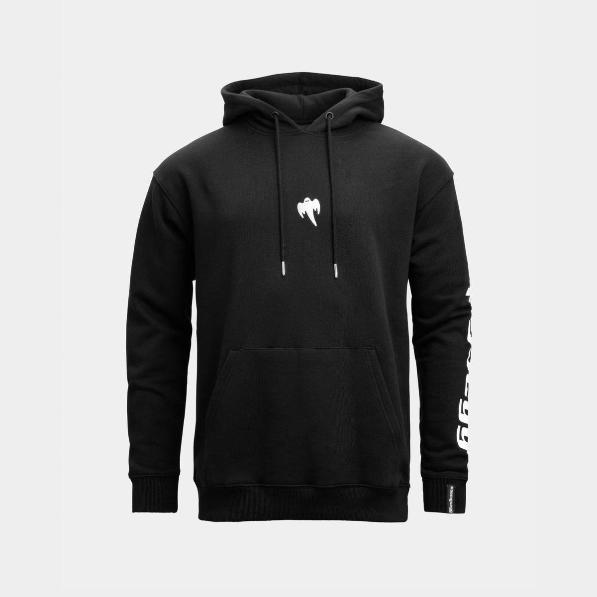 A black Koenigsegg hoodie with a white stylized ghost logo on the center chest and white Koenigsegg brand text printed down one sleeve, shown against a light gray background.