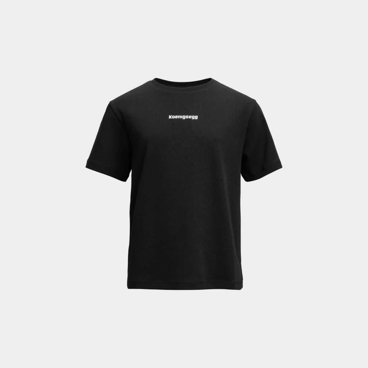 A black short-sleeve crewneck t-shirt with the brand name 'Koenigsegg' printed in white across the chest, displayed on a light gray background.