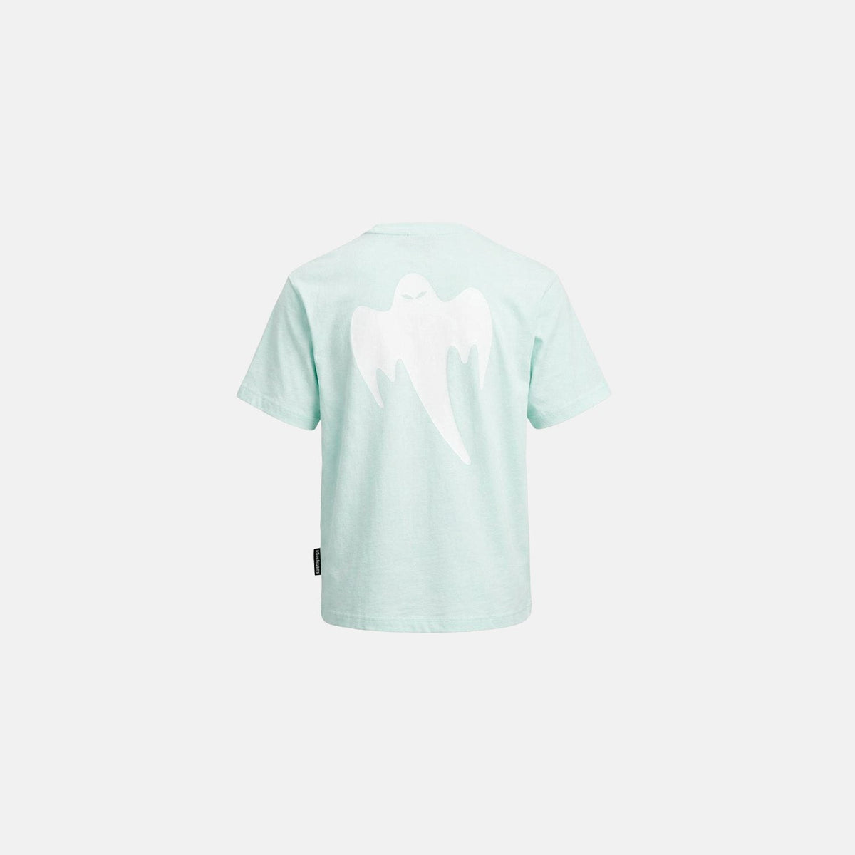 A mint green short-sleeve t-shirt shown from the back, featuring a large white ghostl graphic across the upper back and a small black brand tag near the lower left hem, set against a solid off-white background.