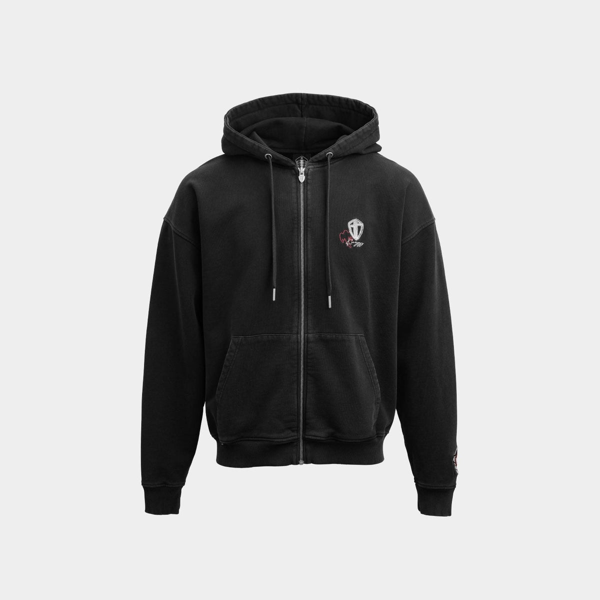 A black zip-up hoodie with a small embroidered crest logo on the left chest, displayed against a solid light gray background.